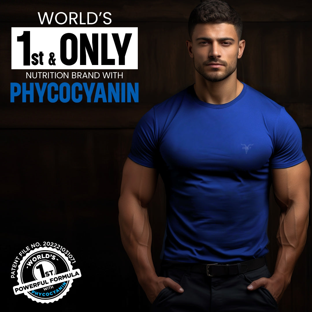  orange Man wearing a blue shirt with text about a nutrition brand featuring phycocyanin on a dark background